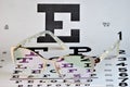 Vision glasses optics and the table of check of sight. Royalty Free Stock Photo