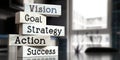 Vision, goal, strategy, action, success - words on wooden blocks Royalty Free Stock Photo