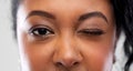 Close up of african american woman winking one eye