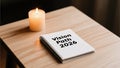 Vision Path 2026 Notebook with Candle on Wooden Table Surface Royalty Free Stock Photo