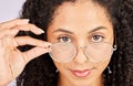 Vision, portrait and black woman in studio, confident and holding spectacles frame. Face, attitude and prescription