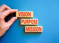 Vision purpose mission symbol. Concept word Vision Purpose Mission on beautiful block. Beautiful blue table blue background.