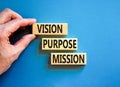 Vision purpose mission symbol. Concept word Vision Purpose Mission on beautiful block. Beautiful blue table blue background.