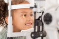 Vision, test and girl for eye exam in the opthalmologist office with equipment for glasses. Optics, examination and