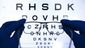 Vision test with letters and selection of lenses for glasses.concept of poor vision. Royalty Free Stock Photo