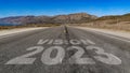 Vision 2023 written on highway road to the mountain