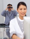 Visionary businessman using binoculars