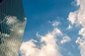 Modern skyscraper with reflections of clouds on windows Royalty Free Stock Photo
