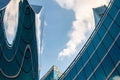 Modern skyscraper with reflections of clouds on windows Royalty Free Stock Photo