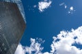 Modern skyscraper with reflections of clouds on windows Royalty Free Stock Photo