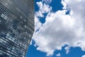 Modern skyscraper with reflections of clouds on windows Royalty Free Stock Photo