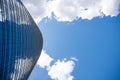 Visionary skyscraper with blue and cloudy sky background Royalty Free Stock Photo