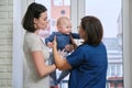 Visit of doctor pediatrician home, mother with baby son talking with doctor