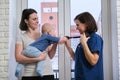 Visit of doctor pediatrician home, mother with baby son talking with doctor