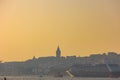 Visit Istanbul background photo. Galata Tower and a cruise ship at sunset. Royalty Free Stock Photo