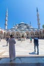Visit Istanbul concept. Tourists and Sultanahmet Mosque aka Blue Mosque