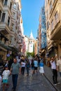 Visit istanbul vertical photo. Street view with tourists and Galata Tower