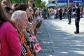 Visit of the royal couple in Warsaw. People holding Union Jack flags and flowers