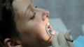 Visit to the dentist, installation of the bracket system and correction of the malocclusion. Orthodontist corrects the
