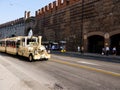 The city wall with a tourist train in Verona in Northern Italy