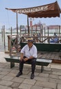 Venice, Italy, Gondolier on the waterfront.