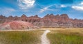 Panoramic View of Badlands Geological Features with prarie in foreground