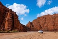 Visiting colorful Wensu Grand Canyon in Autumn with blue sky and white clouds