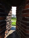 View through the shooting hole of the Muiderslot castle wall, Muiden Castle in the Dutch town Muiden, Holland, the Netherlands