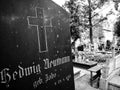 Old gravestone from before World War II. Artistic look in black. Royalty Free Stock Photo