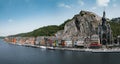 Dinant, Belgium, where the river gracefully guides your gaze towards the vibrant houses