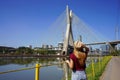 Visiting Sao Paulo, Brazil. Rear view of traveler woman looking at Ponte Estaiada bridge in Sao Paulo, Brazil