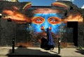 Muslim woman on the streets of Brick Lane with famous graffiti, East London Royalty Free Stock Photo