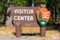 Visitor Center sign with National Park Service arrowhead insignia