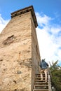 Visitor Climbing Up to the Iconic Medieval Svan Tower, Traditional Fortified Dwelling in Mestia Town, Georgia