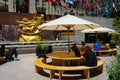 Visitor enjoy outdoors in front of Statue of Prometheus with face mask at the Lower Plaza of Rockefeller Center in Manhattan