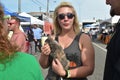 Visitor interacts with rescue kitten from Nashville Cat Rescue at Oktoberfest Event