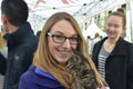 Visitor interacts with rescue kitten from Nashville Cat Rescue at Oktoberfest Event