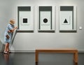 Visitor looking pictures in art gallery museum