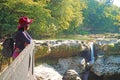 Visitor looking at the waterfall from the observation platform in Martvili canyon, Georgia Royalty Free Stock Photo