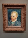 Visitor near the Self-Portrait by Vincent van Gogh painting in Museum d'Orsay in Paris, France. Royalty Free Stock Photo