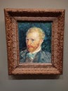 Visitor near the Self-Portrait by Vincent van Gogh painting in Museum d'Orsay in Paris, France.