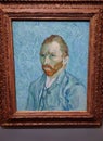 Visitor near the Self-Portrait by Vincent van Gogh painting in Museum d'Orsay in Paris, France. Royalty Free Stock Photo