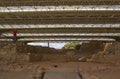 Visitor observing Cancho Roano Archaeological Site. Zalamea de la Serena, Extremadura, Spain