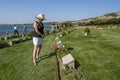 A visitor pays her respect at the Ari Burnu Cemetery at Anzac Cove at Gallipoli in Turkiye. Royalty Free Stock Photo