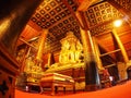 Visitor praying inside of the famous mural painting of the northern THAILAND WAT PHUMIN Royalty Free Stock Photo