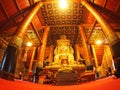 Visitor praying inside of the famous mural painting of the northern THAILAND WAT PHUMIN Royalty Free Stock Photo