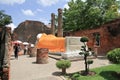 Visitor praying the sleeping buddha in the ancient temple, in Ayutthaya, Thailand Royalty Free Stock Photo