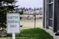 Visitor Reservered parking sign in Office Car Lot