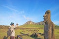 Visitor taking photos of Moai A Vere Ki Haho or Traveling Moai, a Solitary Moai at the entrance of Ahu Tongariki Royalty Free Stock Photo