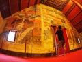 Visitor taking picture of the famous mural painting of the northern THAILAND WAT PHUMIN Royalty Free Stock Photo